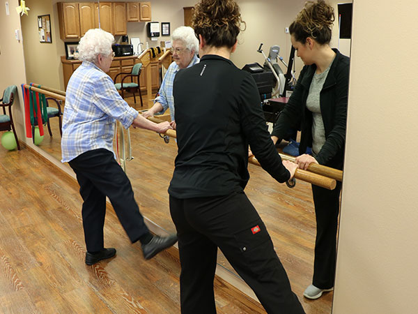 Senior receiving physical therapy